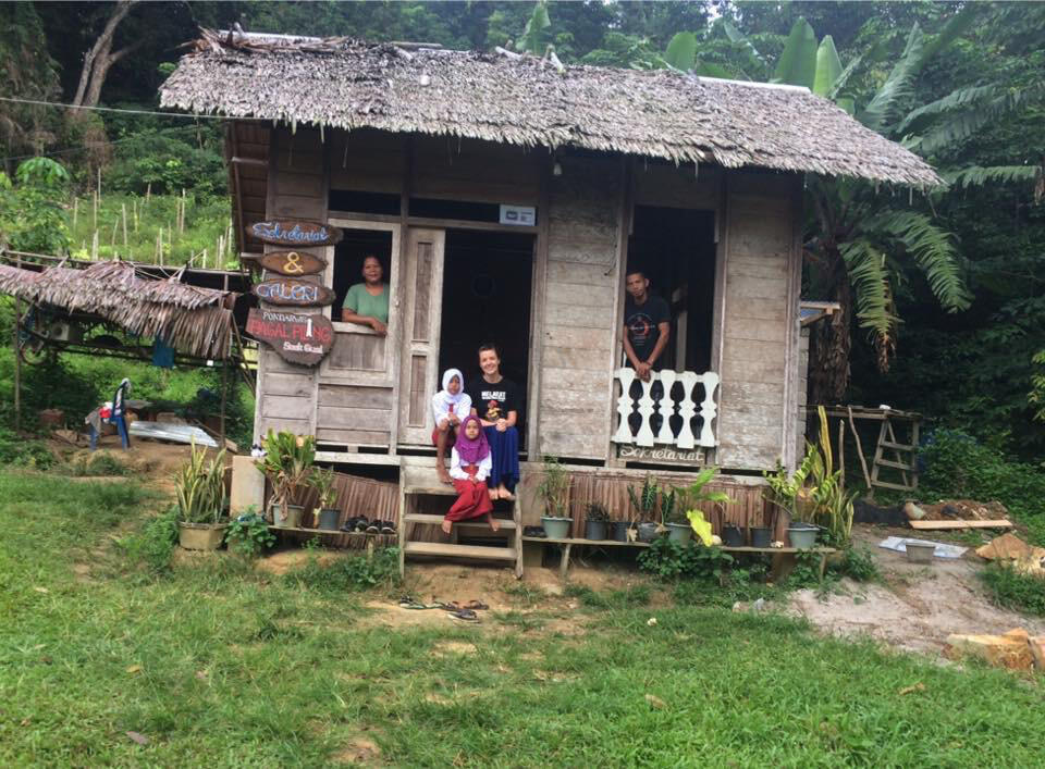 Standiford, sitting on the front steps, is currently living on the island of Medanau in Belitong, Indonesia.