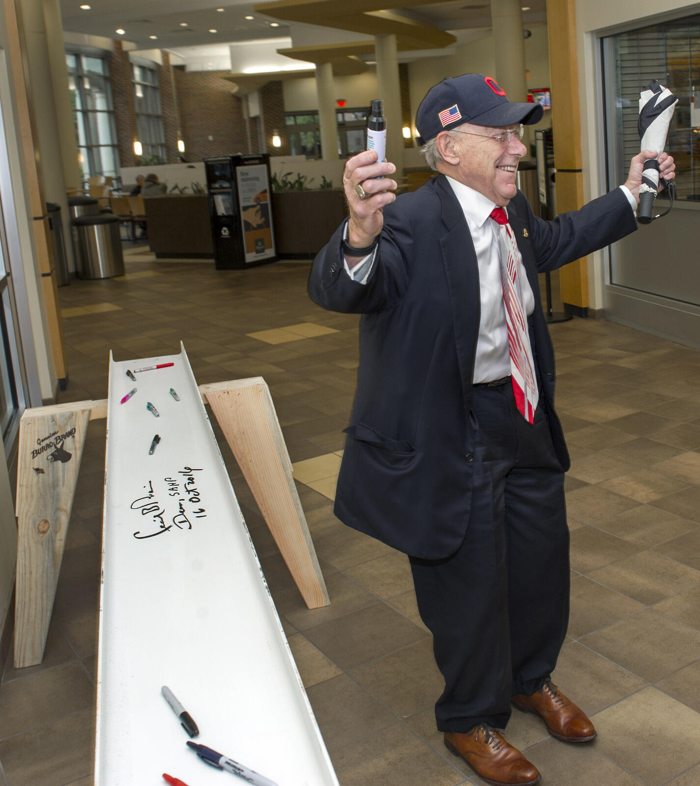VCU School of Allied Health Professions Dean Cecil B. Drain, Ph.D., celebrates signing the beam at the topping out ceremony. Drain has served as dean of the school for 20 years and has made it a personal mission to unite the school's units under one roof.