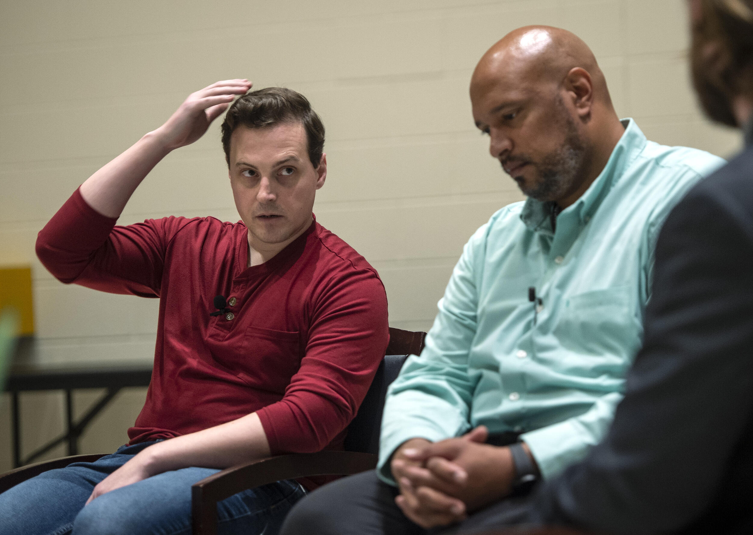 Two men sitting in chairs 