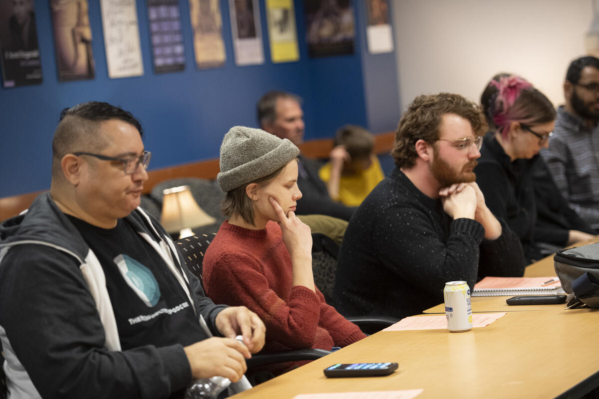 Participants seated at a table.