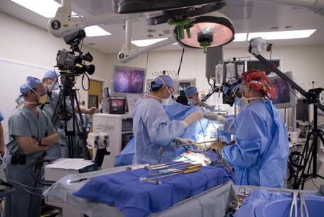 Cameras follow the action as VCU Medical Center’s cardiac surgery team led by Dr. Vigneswar Karisajan perform a procedure to treat atrial fibrillation. The live teaching broadcast was beamed to physicians attending a conference in Boston. Dr. Kenneth Ellenbogen, (far left), director of VCU’s cardiac electrophysiology lab, narrated during the procedure.

Photos by Joe Kuttenkuler, VCU News Services  