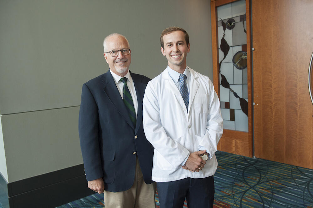 Sam Kraus, right, and his father, Harry Kraus Jr., a 1986 VCU graduate. (Photo by Tom Kojcsich, University Relations)
