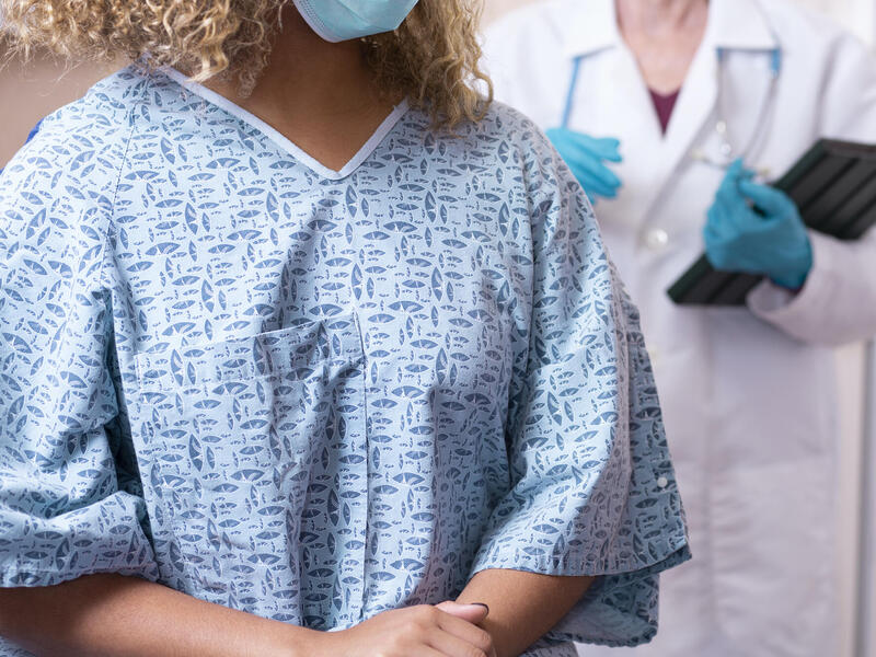 woman wearing hospital gown