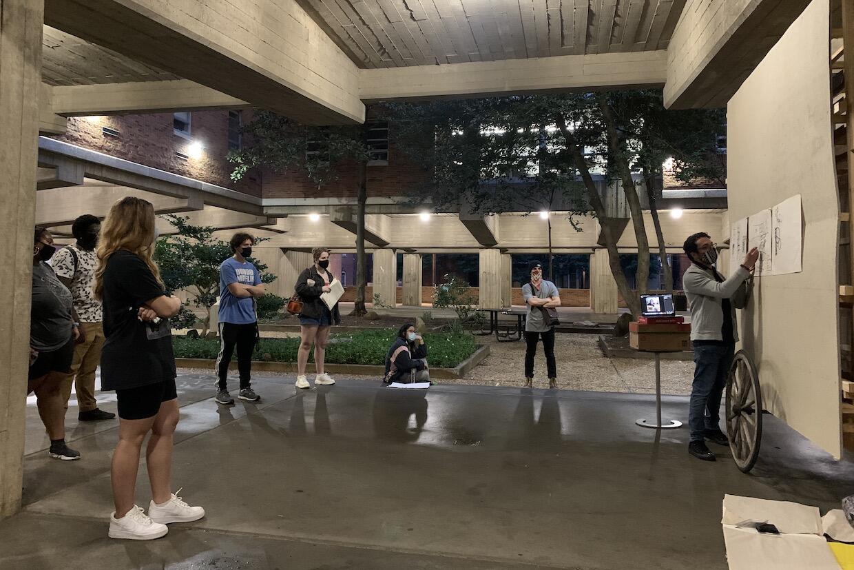 Students in the Pollak courtyard discuss their work.