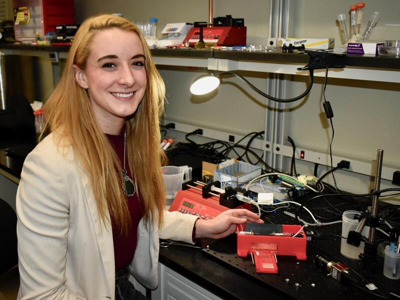 Sarah Saunders seated in a laboratory.