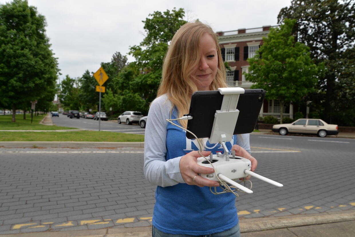 Ashley McCuistion, digital curator and public outreach coordinator of the Fairfield Foundation, pilots a drone on Monument Avenue.
