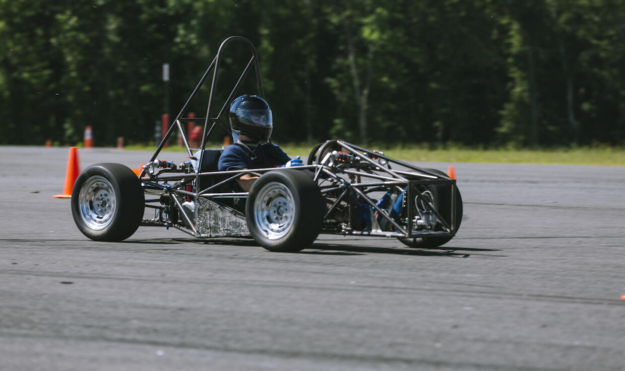 Formula race car being driven by a VCU student on a test track
