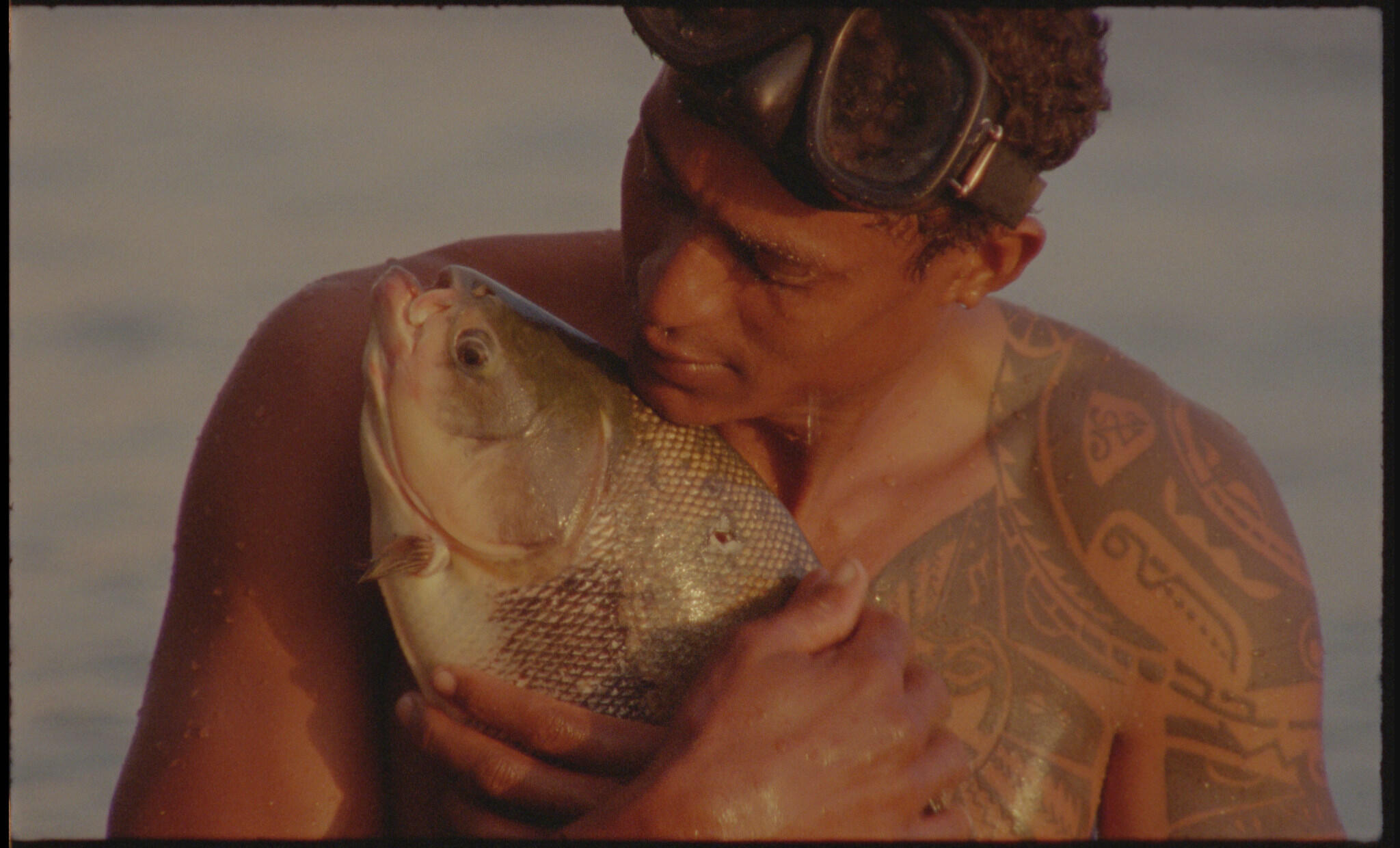 A video and photo series “O peixe” by Jonathas de Andrade.