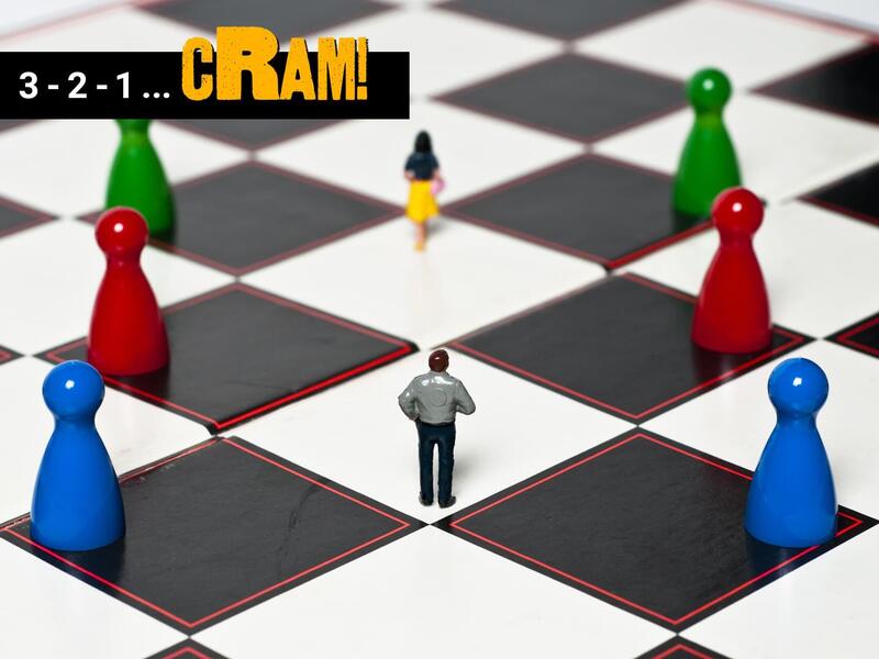 A 3D illustration of two people walking across a black and white game board with blue, red, and green playing pieces on either side of them. In the upper left corner is white and yellow text that reads \"3 - 2 -1 - cRAM!\" 