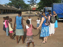 On the right, VCU students Jessica Secor, Susan Phipps, and Meredith Cofield participate in a weekly program where children who are homeless come to this center on Sunday to attend Sunday school. They also receive a free meal and first aid. The activities are sponsored by Sovereign Global Missions.

Photo by Stacey Reynolds
