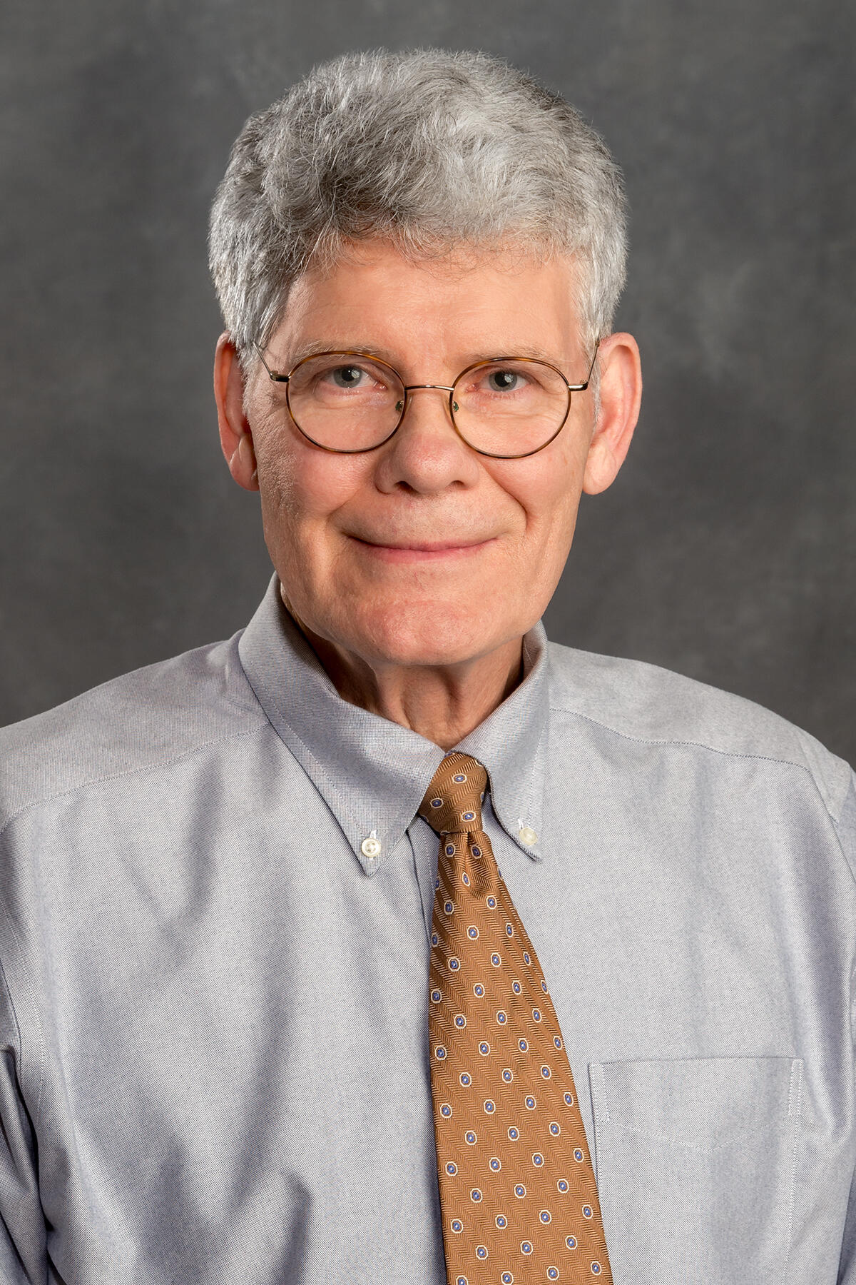 A portait of a man from the chest up