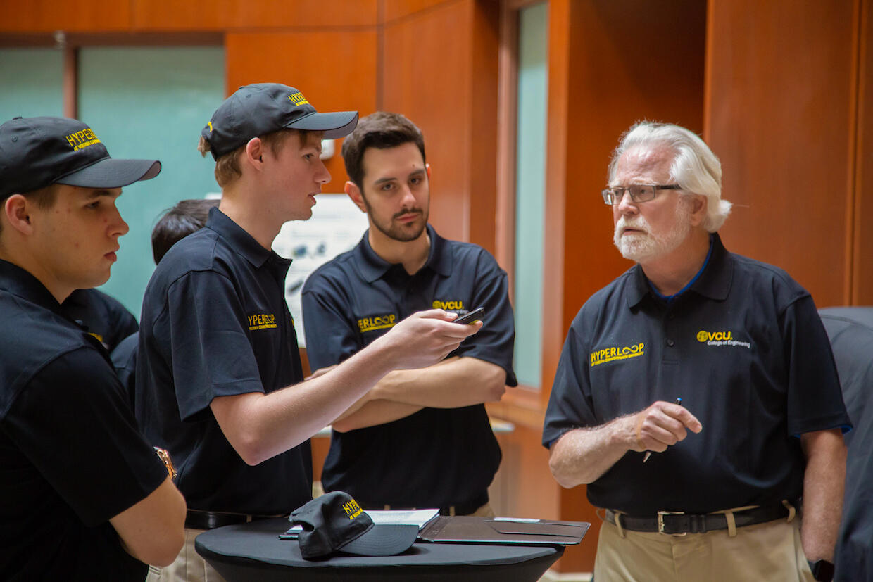 John Naylor, Arthur Chadwick and Matthew Kozak consult with Hyperloop at VCU adviser L. Franklin Bost. (Photo by Alexandria Tayborn, VCU College of Engineering)