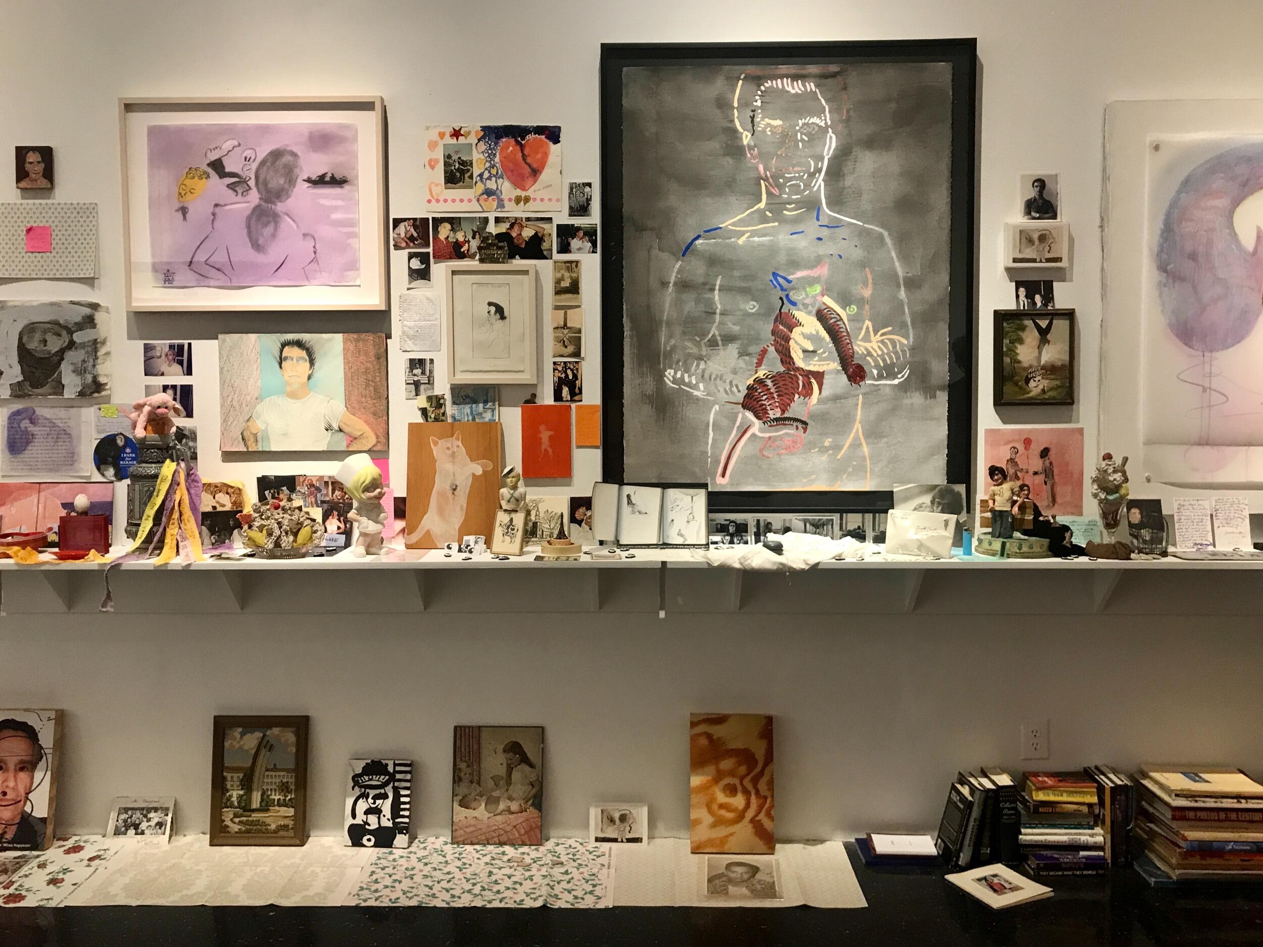 Ephemera on shelves from the home of Joan Gaustad and Jerry Donato, on display as part of an exhibition at The Anderson