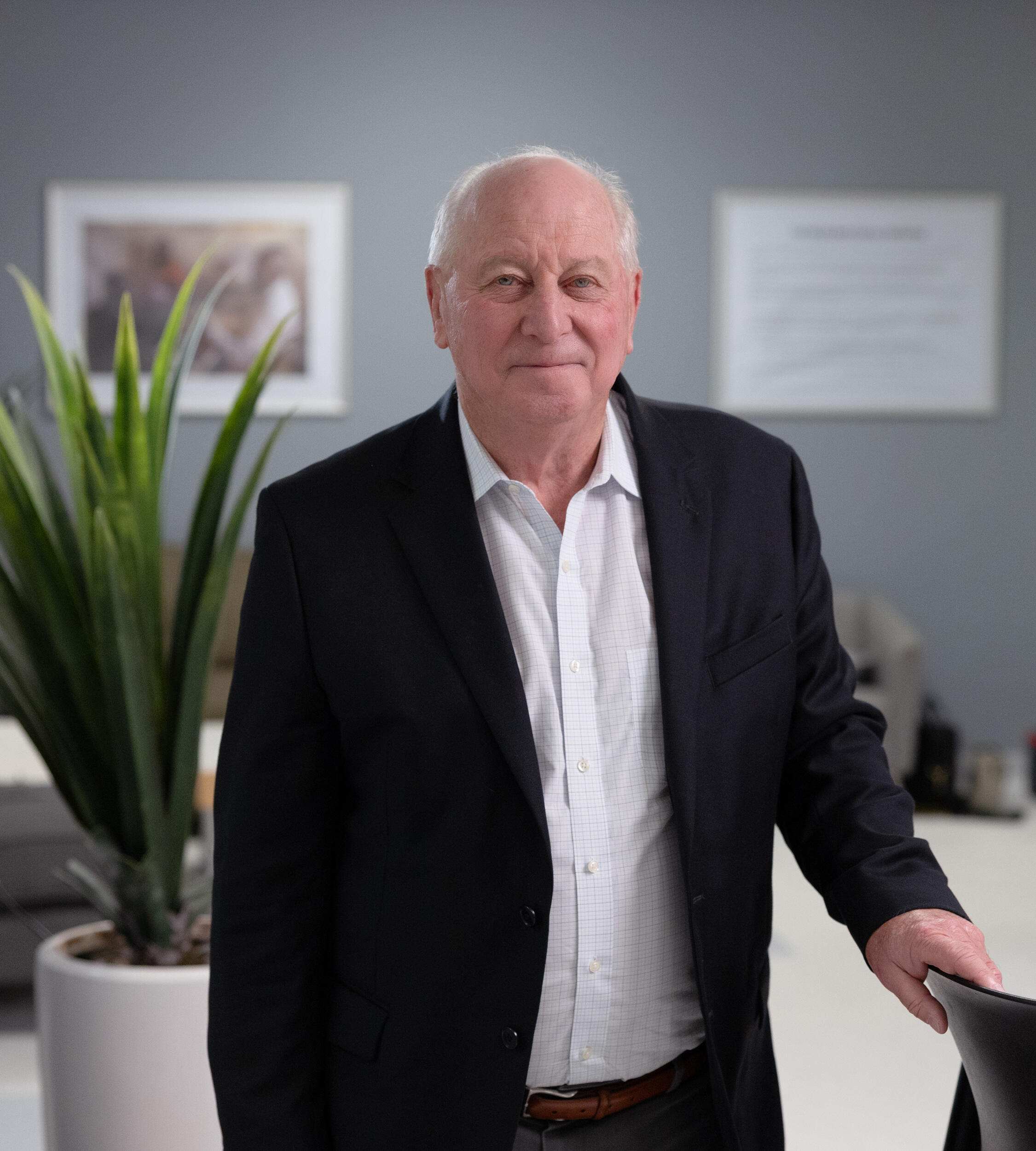 A photo of a man from the waist up. 