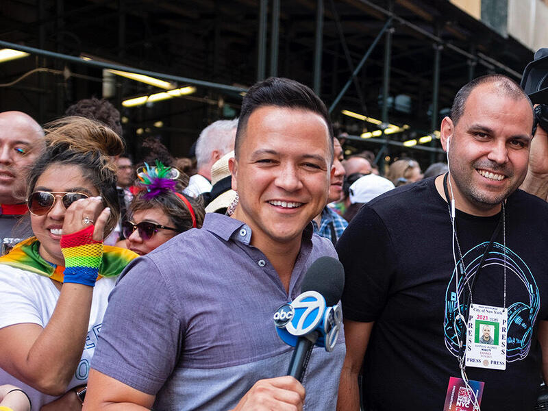 Derick Waller, left, with TV news colleagues 