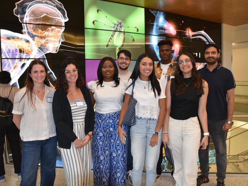 A group photo of eight people standing.