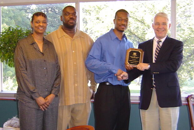 Calvin Cropper Jr., his parents and then-School of Engineering Dean Russell Jamison, Ph.D., standing for a photo