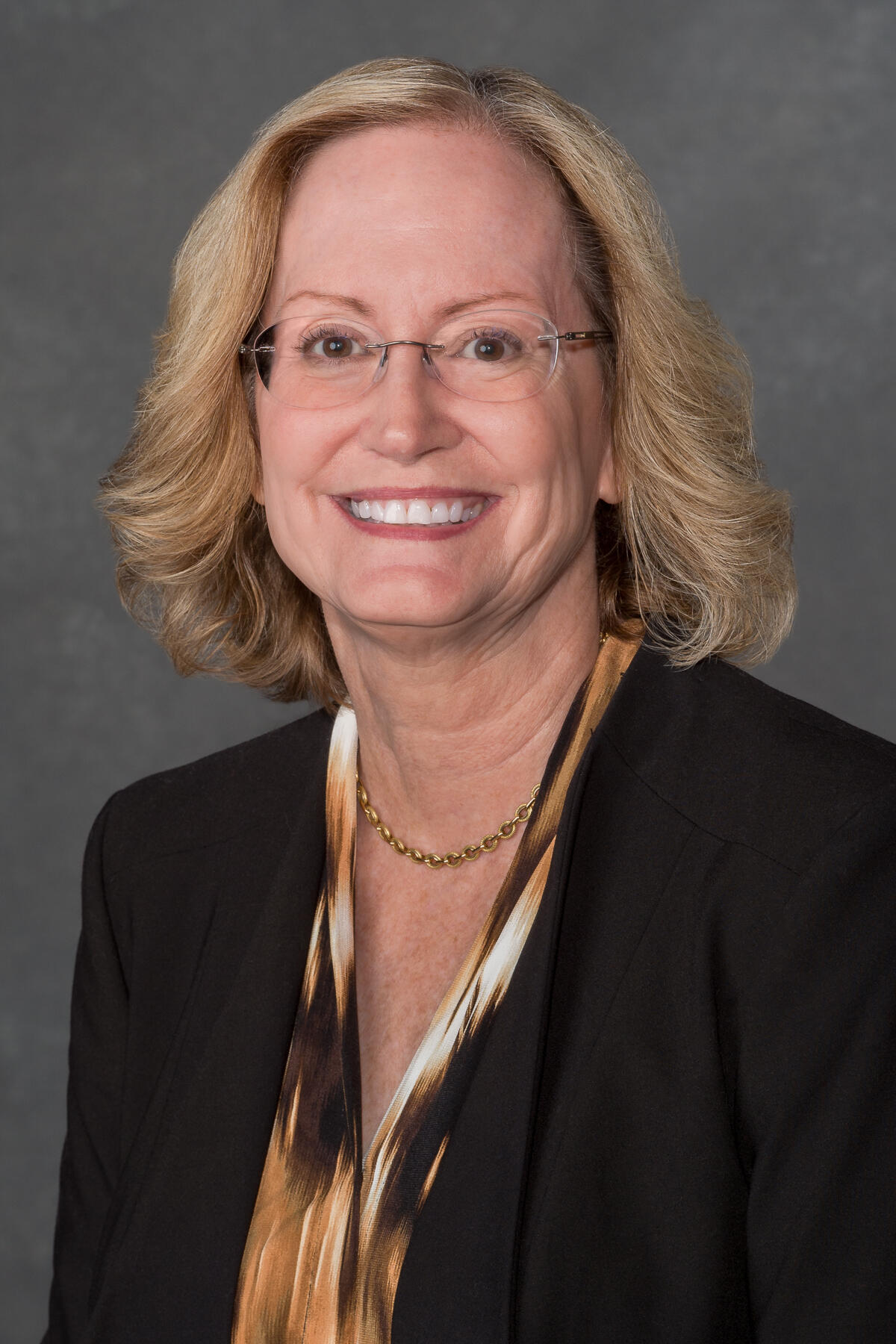 A portait of a woman from the chest up. 