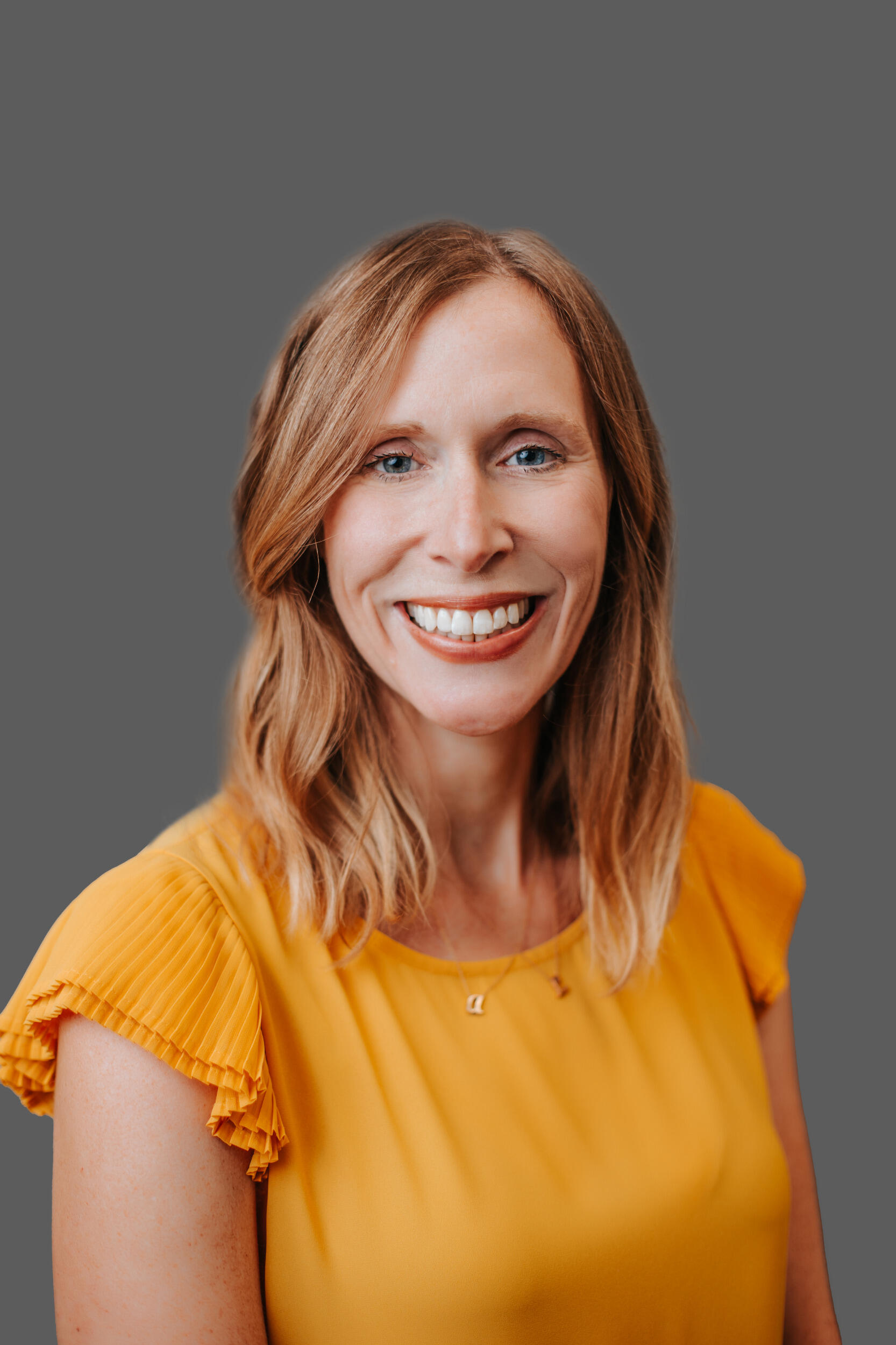 Head and shoulders image of Lindsay M. Andiola, smiling.