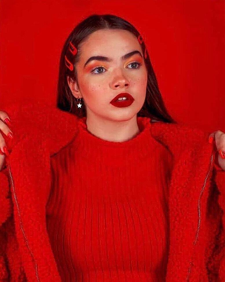 Portrait of woman in red clothes with red background