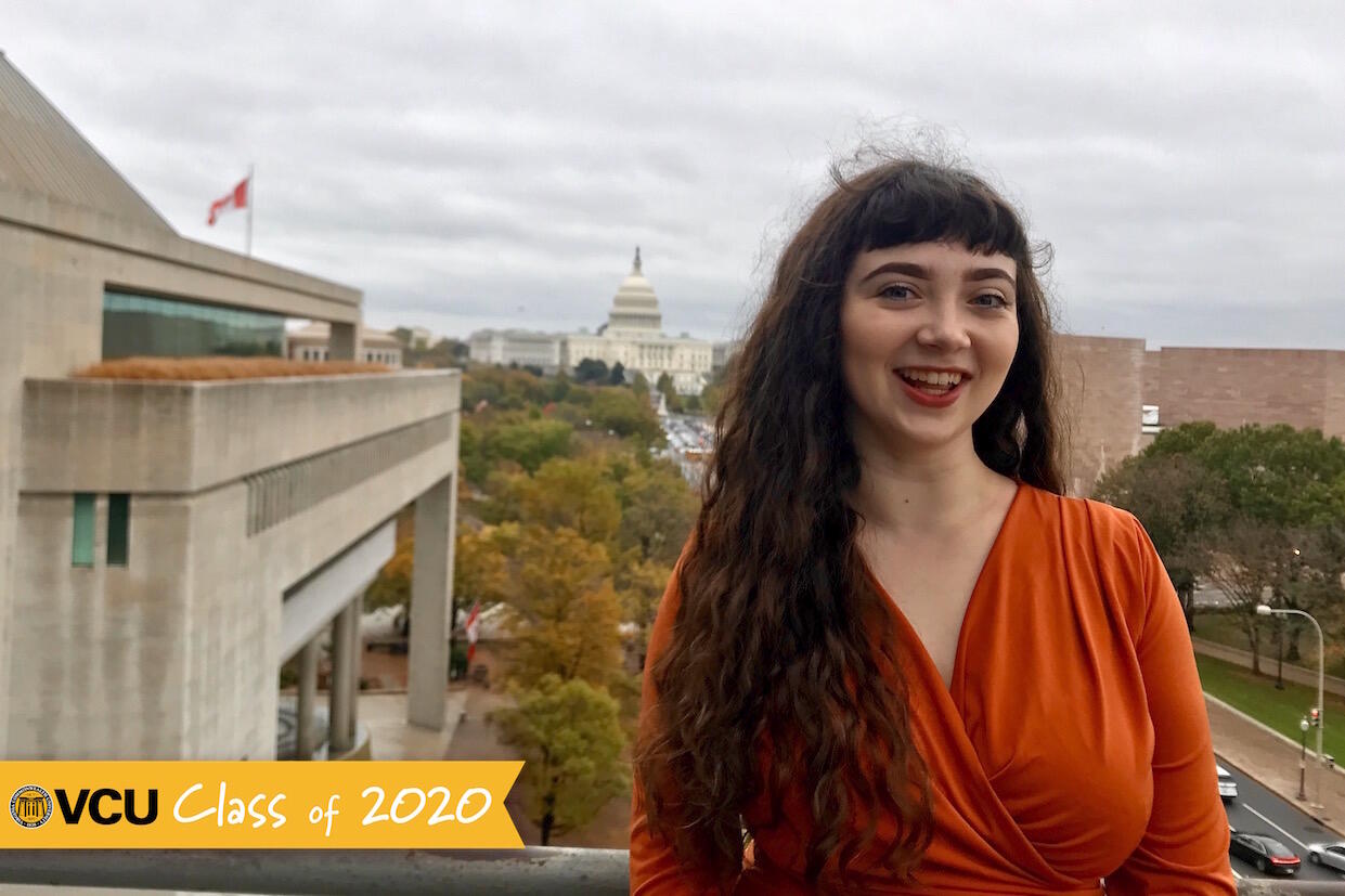 A student standing on the outdoor patio of the Newseum.