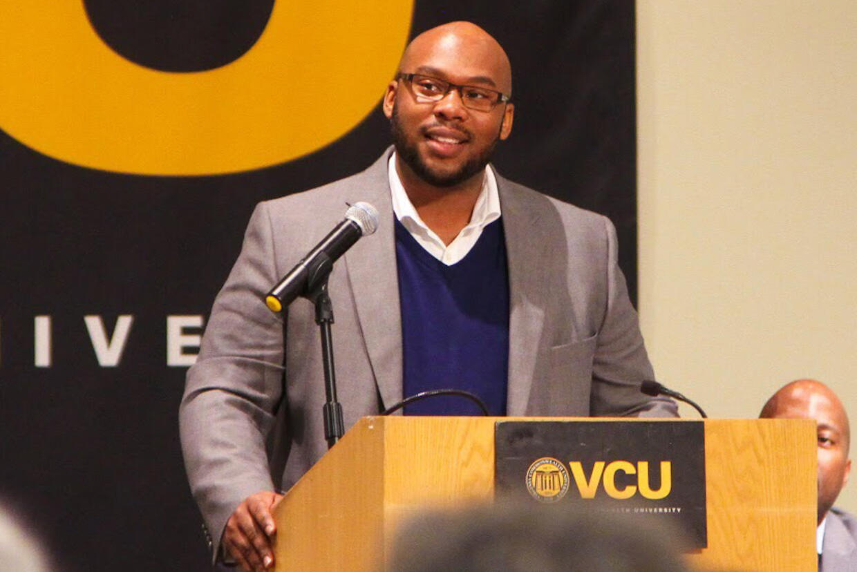 Corey Boone standing at a podium.