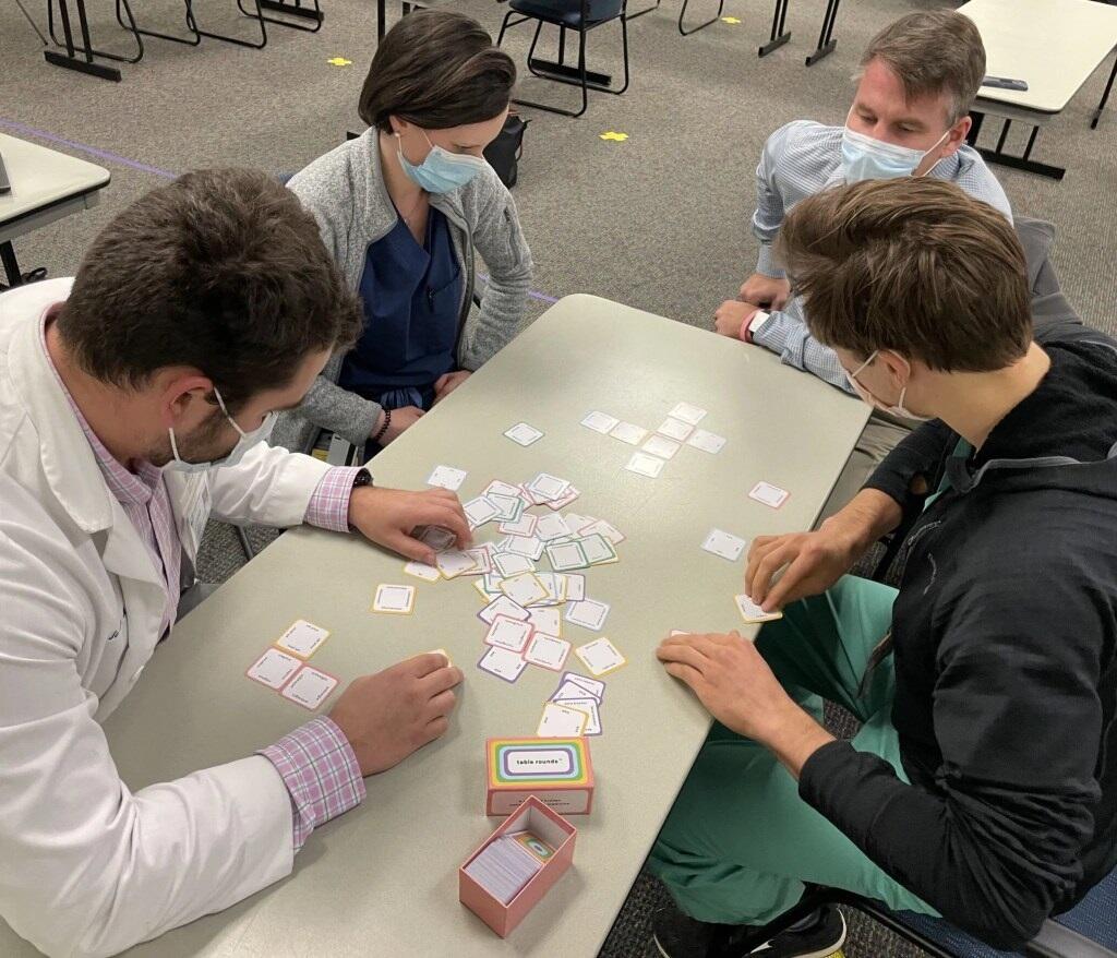 Riverside: Playing Table Rounds (clockwise from left): Riverside Family Medicine resident Jordan Dehli; Christina Rittenhouse, an Edward Via College of Osteopathic Medicine student; Jon Kaminer, associate director of the Riverside residency program; and John Nestler, a VCU School of Medicine student.