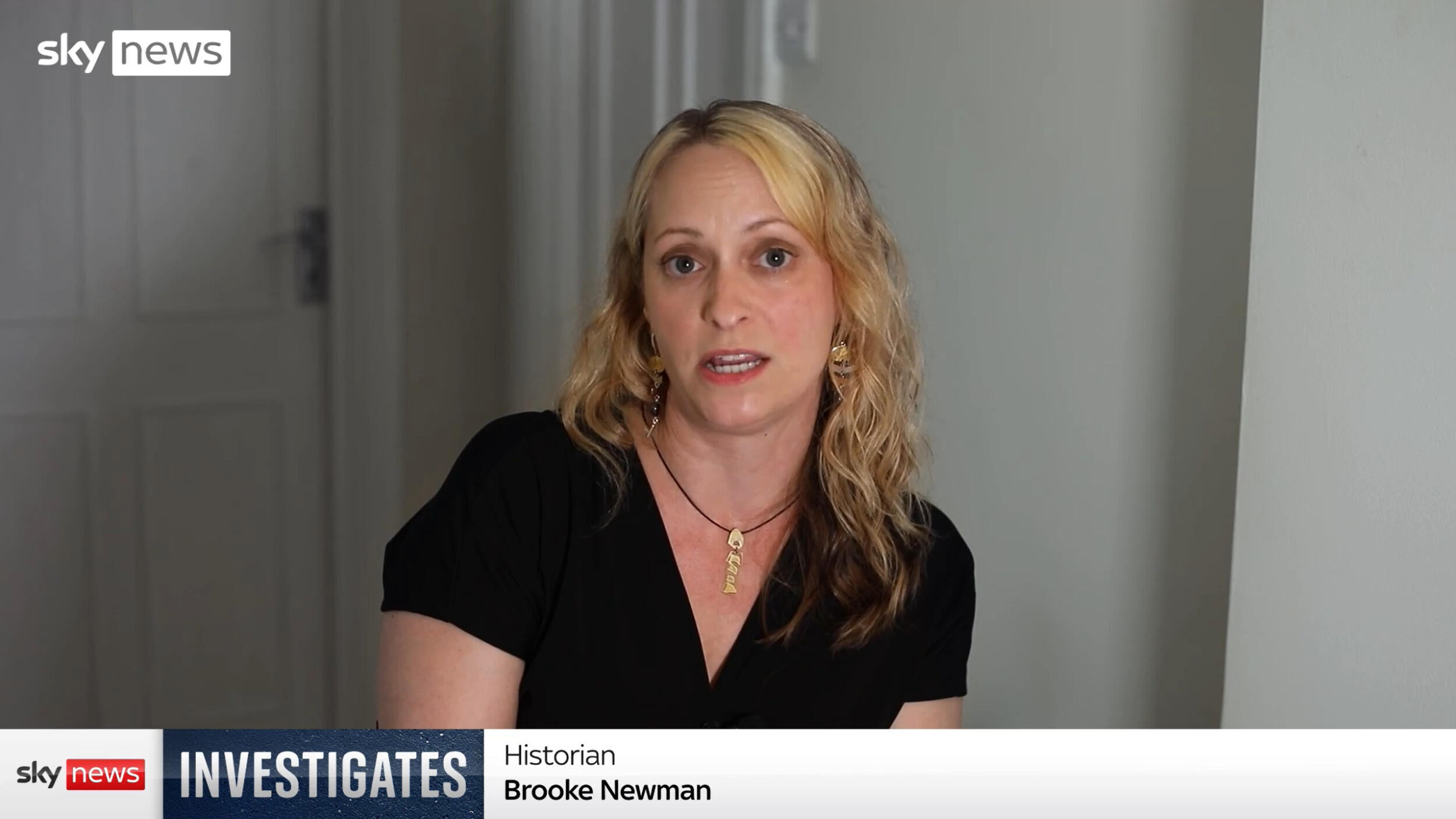 A woman speaks to TV viewers in a documentary, while a \"Sky News Investigates\" graphic indicates her name as \"Brooke Newman\" and her title as \"historian.\"