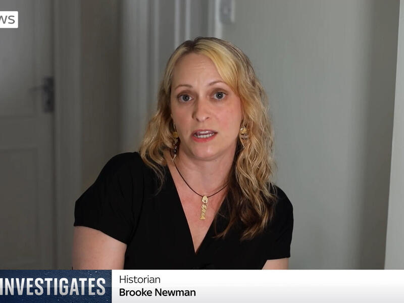 A woman speaks to TV viewers in a documentary, while a \"Sky News Investigates\" graphic indicates her name as \"Brooke Newman\" and her title as \"historian.\"