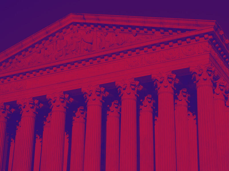 A blue and red photo of the Supreme Court building. 
