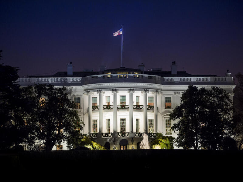 A photo of the White House at night. 