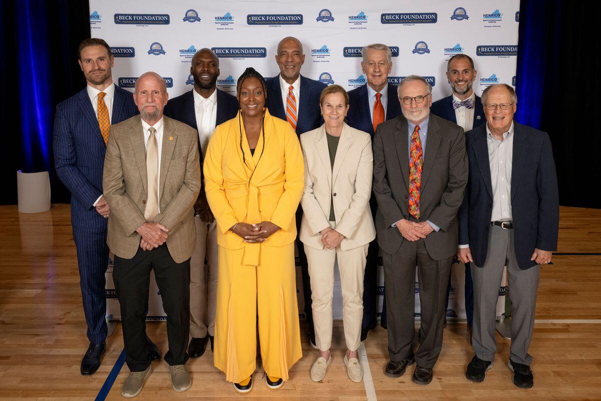 A group photo of 10 people standing in two rows. 