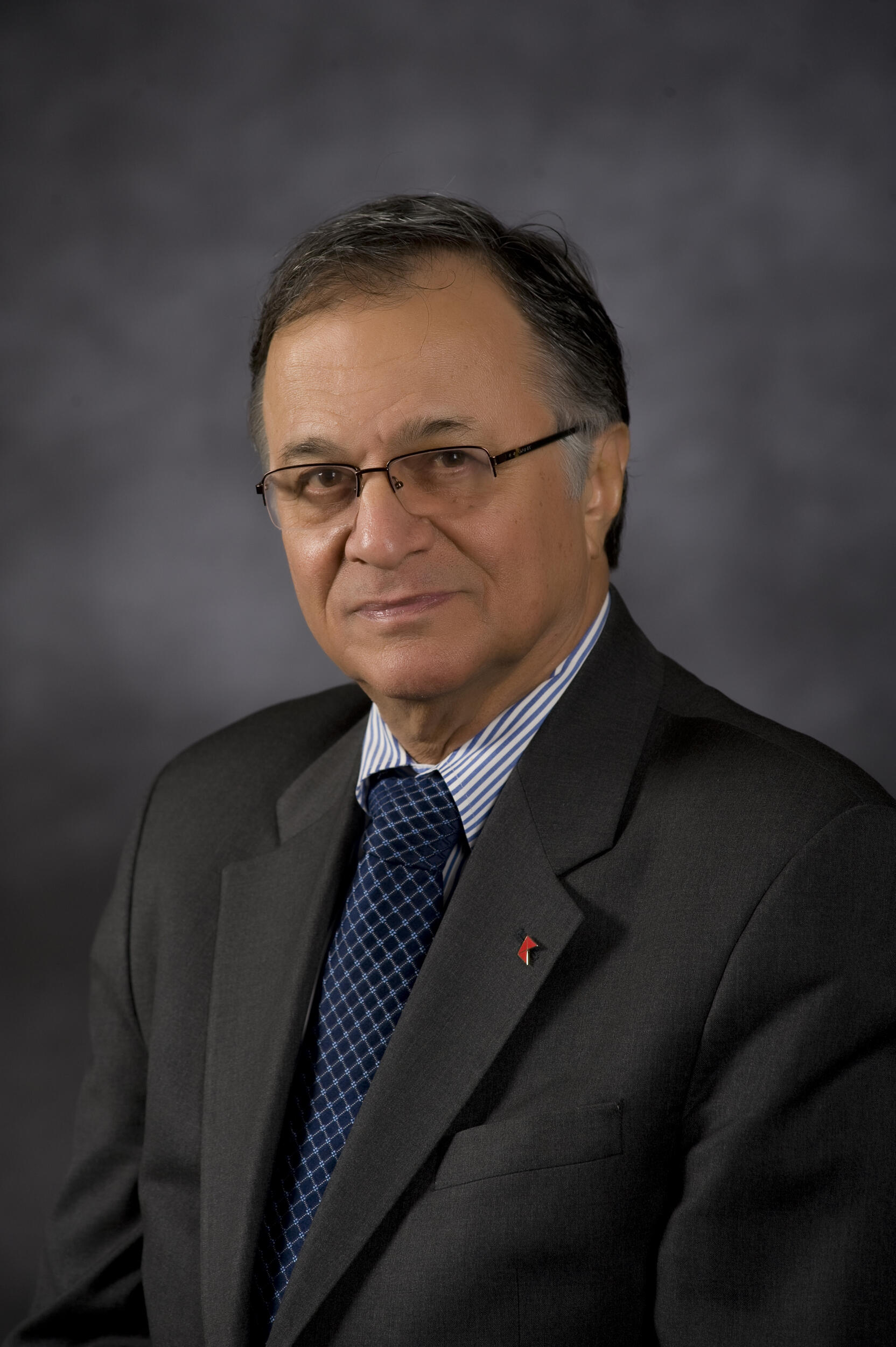 A photo of a man from the chest up