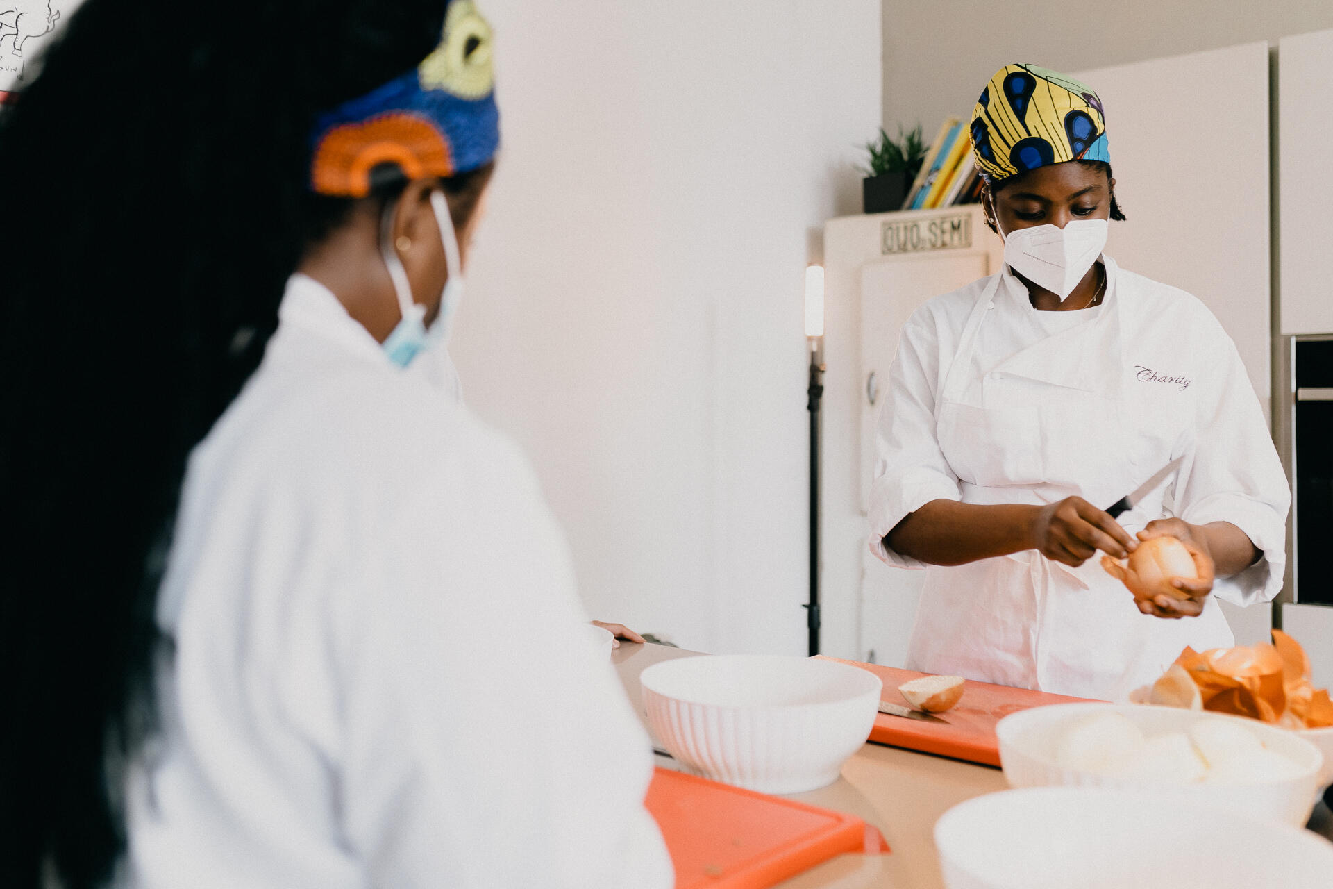 woman wearing a mask at a culinary class