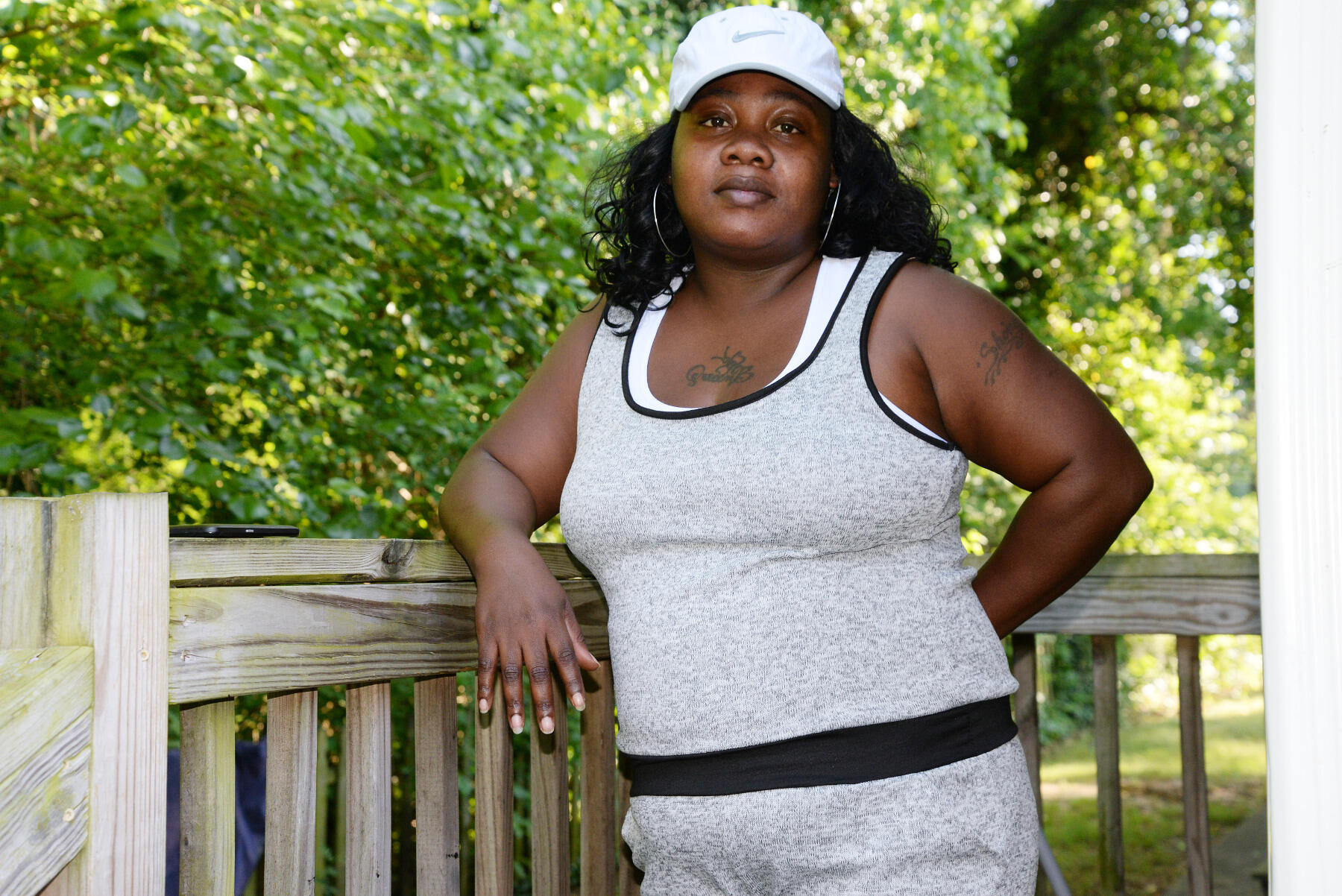 Tavara Webb stands on the deck outside her apartment in Richmond's northside.