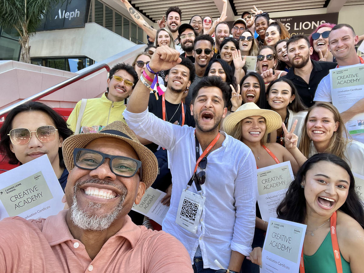 People smiling on a staircase 